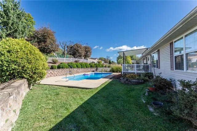 a view of a swimming pool with a patio