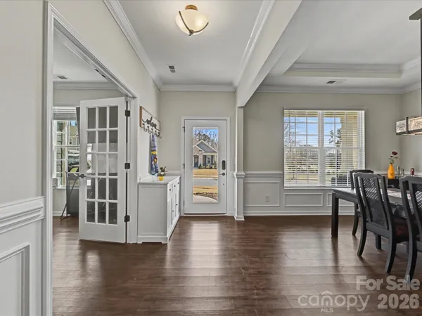 a view of a livingroom with furniture window and wooden floor