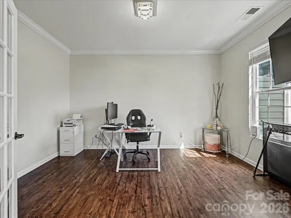 a workspace with furniture and wooden floor