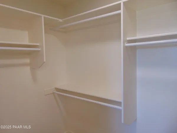 a view of an empty walk in closet
