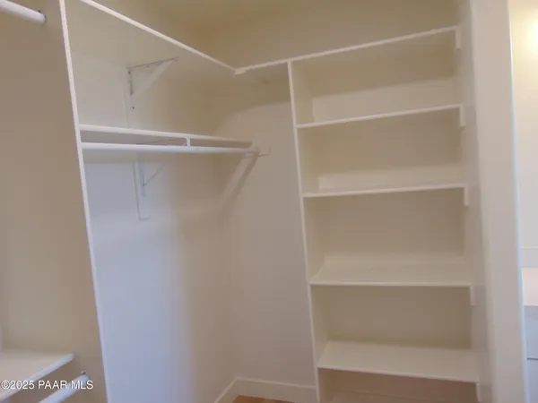 a view of an empty walk in closet