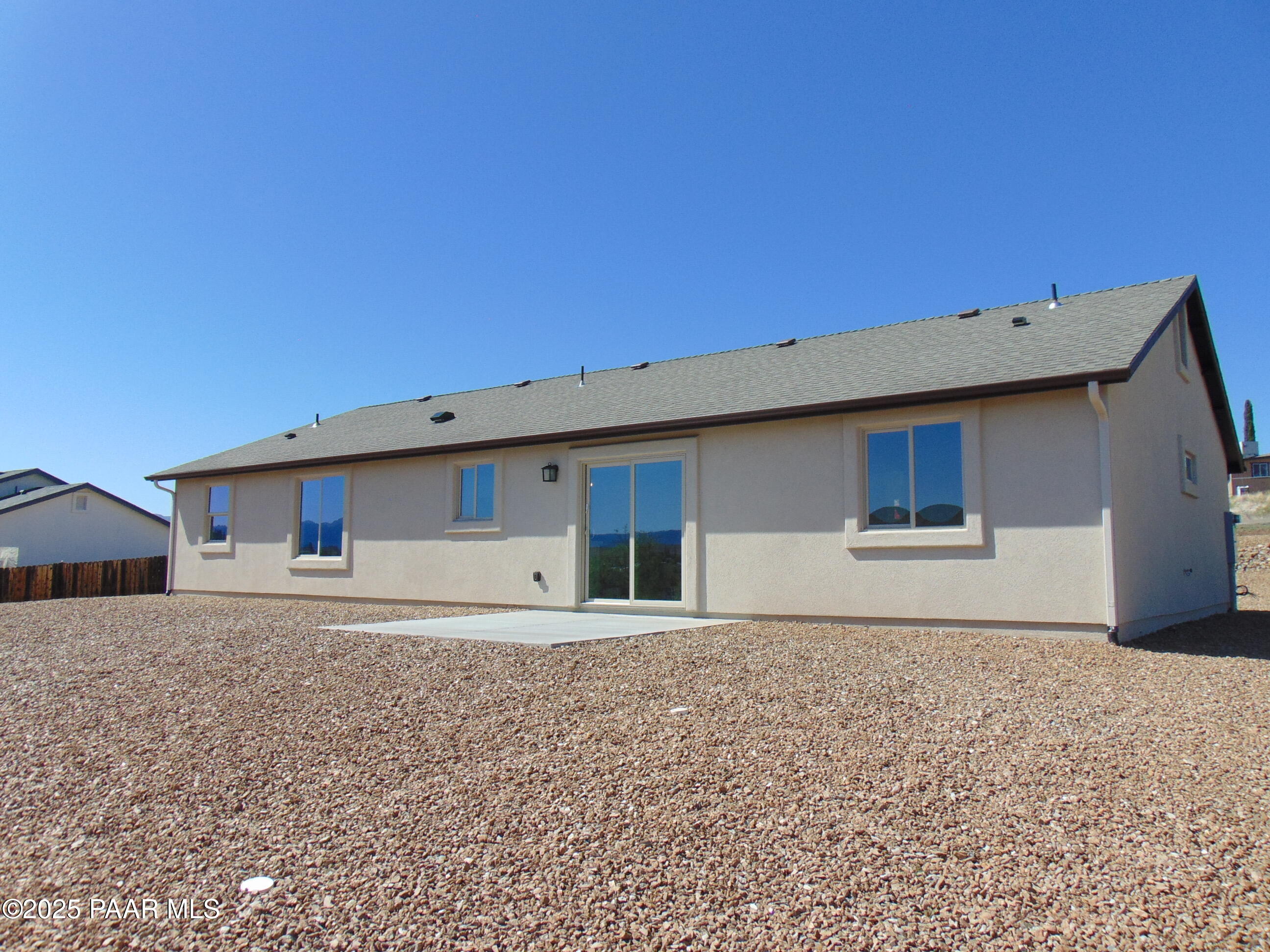 17707 East Jackrabbit Road Mayer, AZ 86333 - Photo 19 of 21 a house with trees in the background