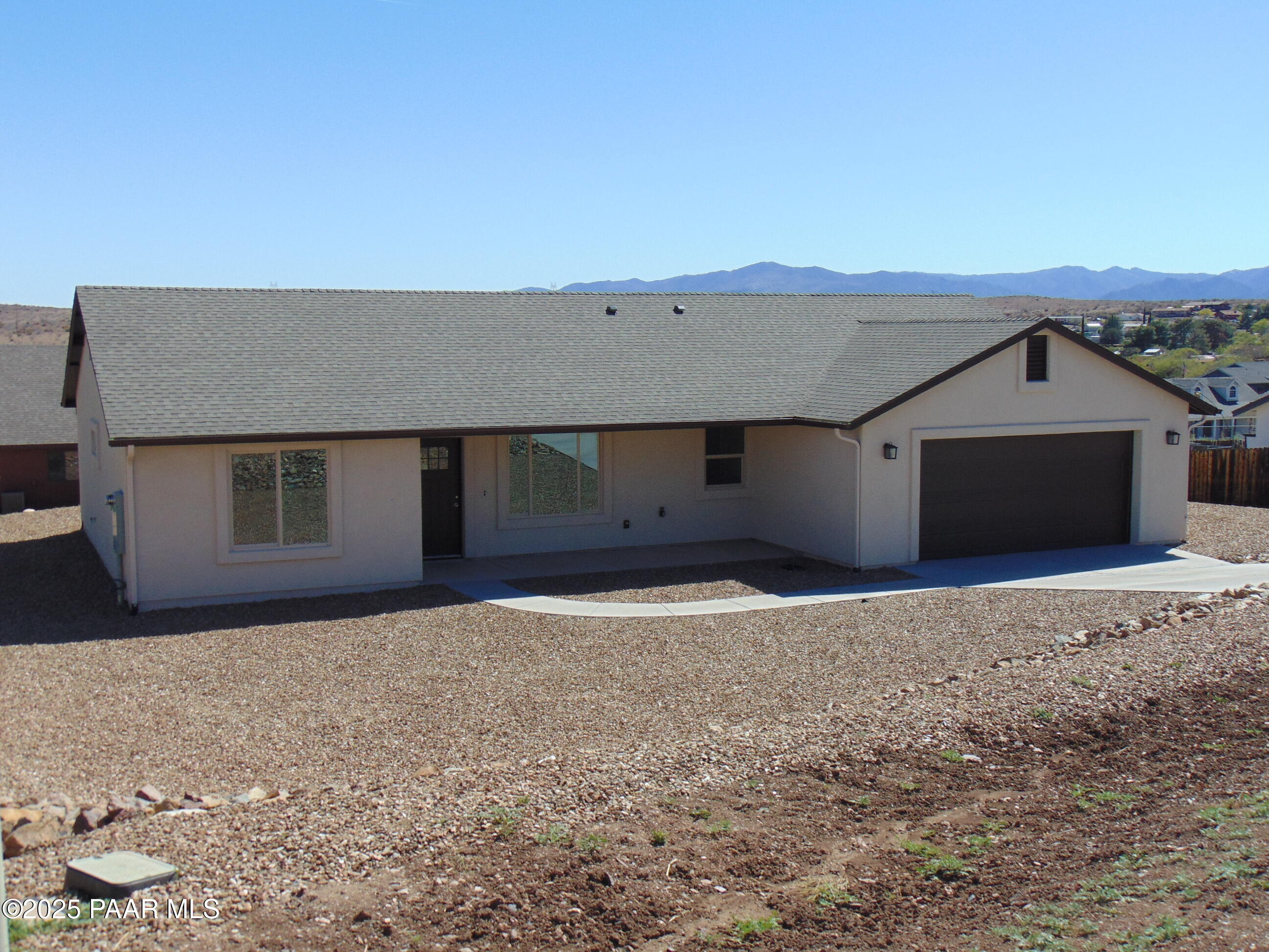 17707 East Jackrabbit Road Mayer, AZ 86333 - Photo 2 of 21 a front view of a house with a yard