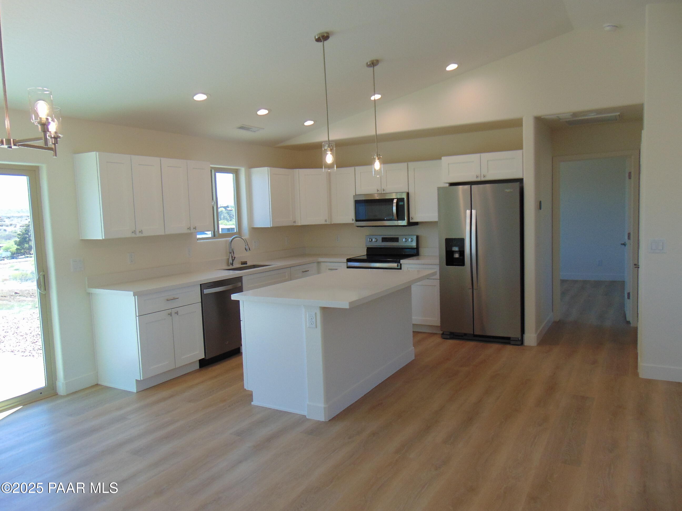 17707 East Jackrabbit Road Mayer, AZ 86333 - Photo 7 of 21 a kitchen with kitchen island wooden cabinets and stainless steel appliances