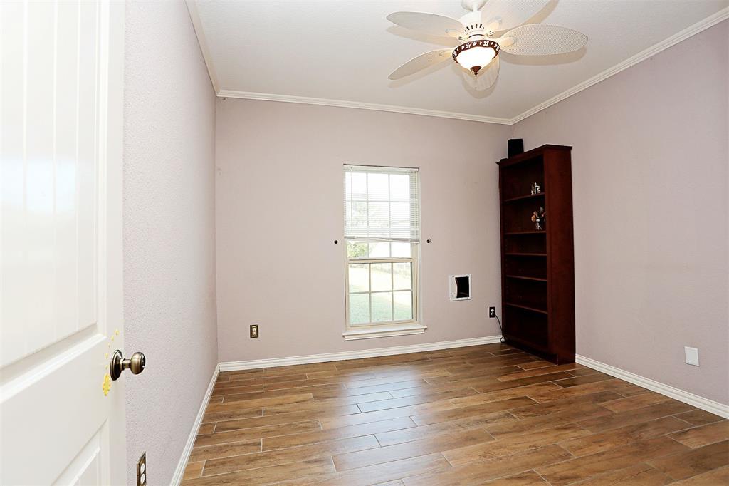 812 Ebenezer Road Palmer, TX 75152 - Photo 13 of 27 wooden floor in an empty room with a window