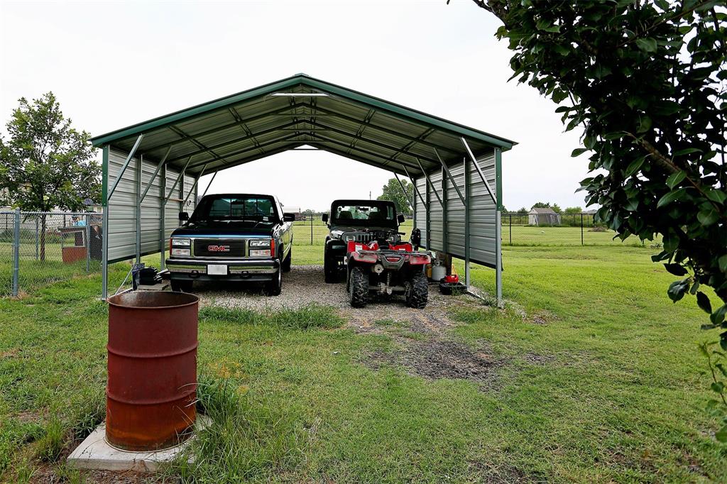 812 Ebenezer Road Palmer, TX 75152 - Photo 24 of 27 a view of a car parked in the yard
