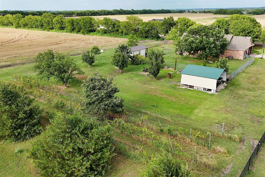 812 Ebenezer Road Palmer, TX 75152 - Photo 26 of 27 a view of a garden with a lake