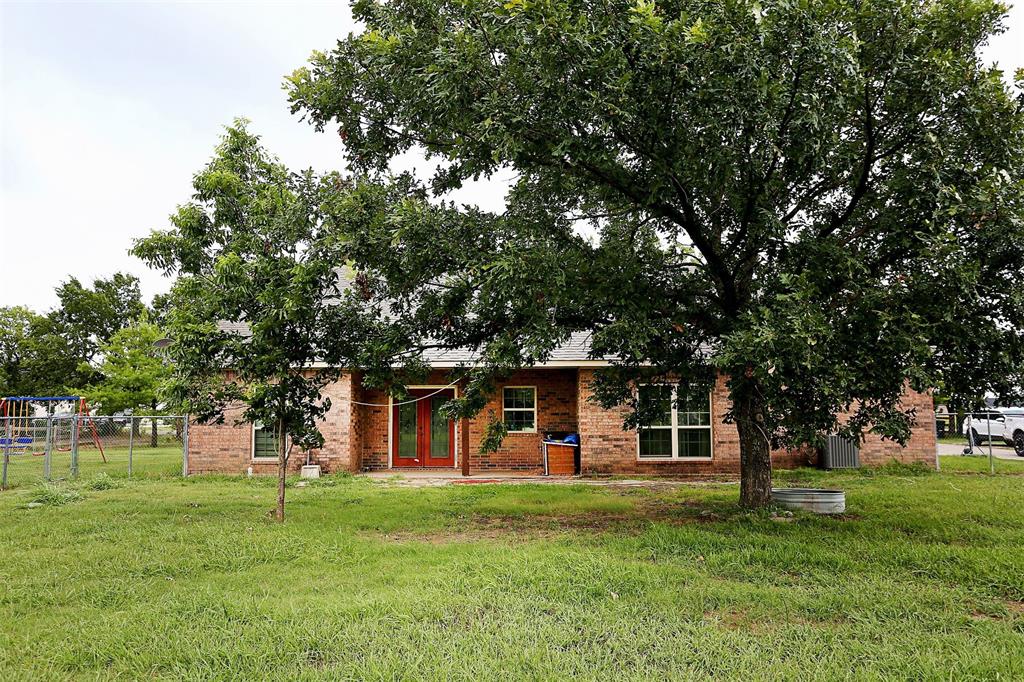 812 Ebenezer Road Palmer, TX 75152 - Photo 5 of 27 a view of a house with a backyard