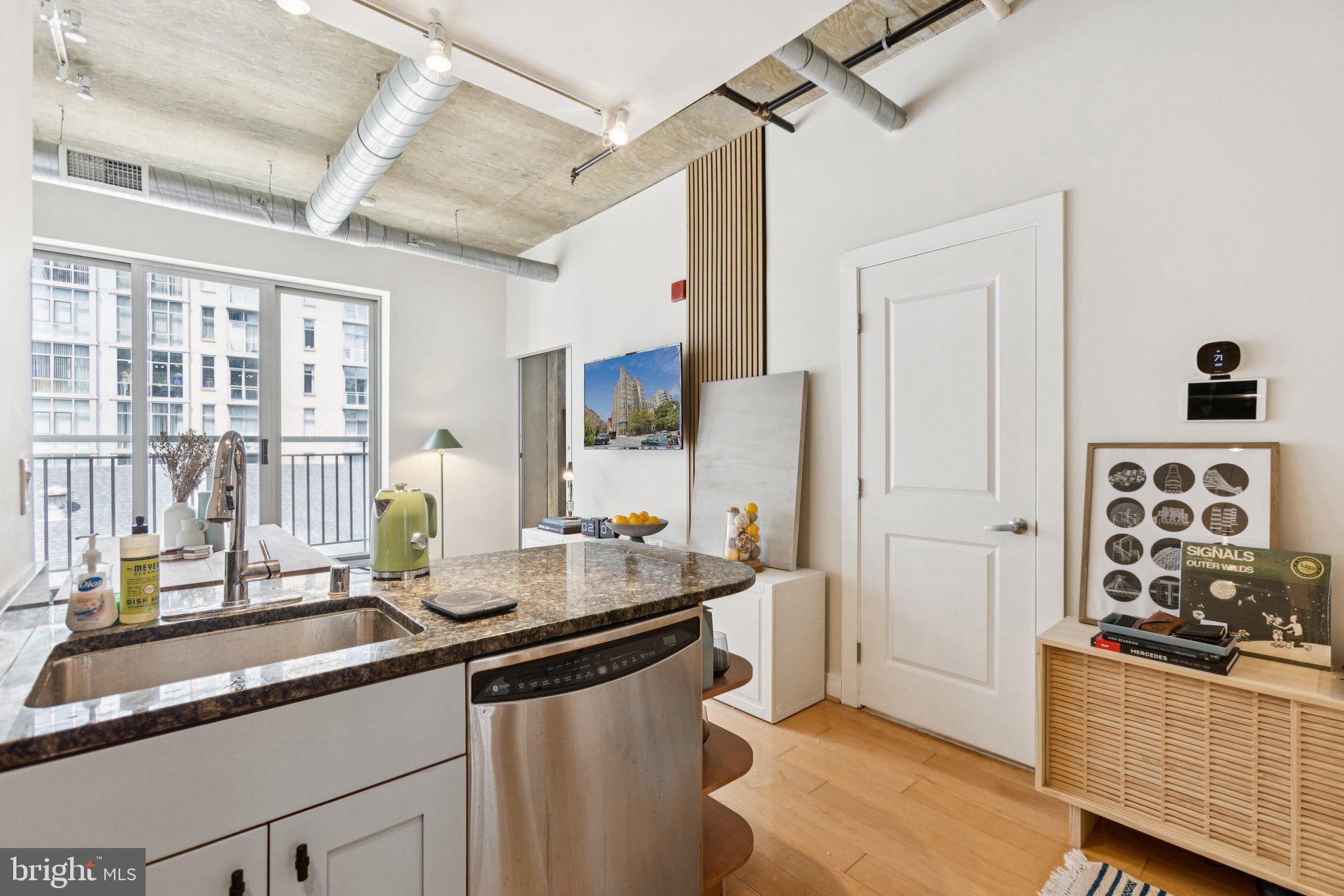301 Massachusetts Avenue Northwest, Unit 606 Washington, DC 20001 - Photo 1 of 25 a kitchen with sink and refrigerator