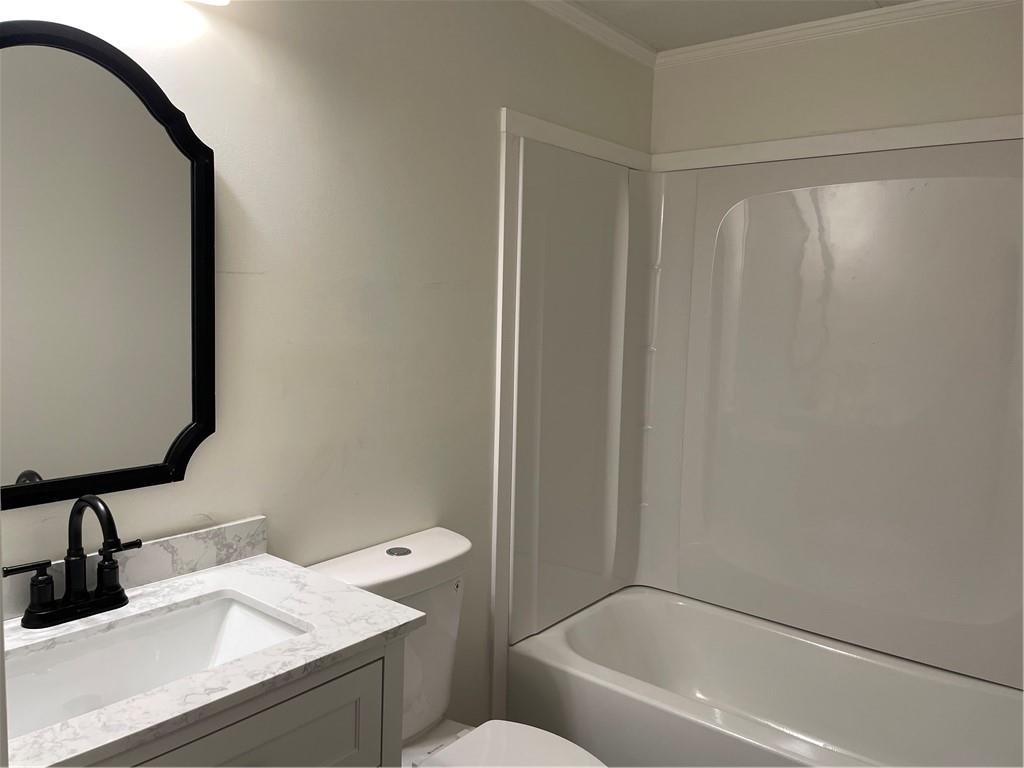 383 Bagwell Road Dawsonville, GA 30534 - Photo 17 of 24 a bathroom with a granite countertop sink toilet and a mirror