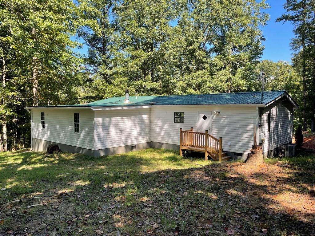 383 Bagwell Road Dawsonville, GA 30534 - Photo 19 of 24 front view of a house with a yard