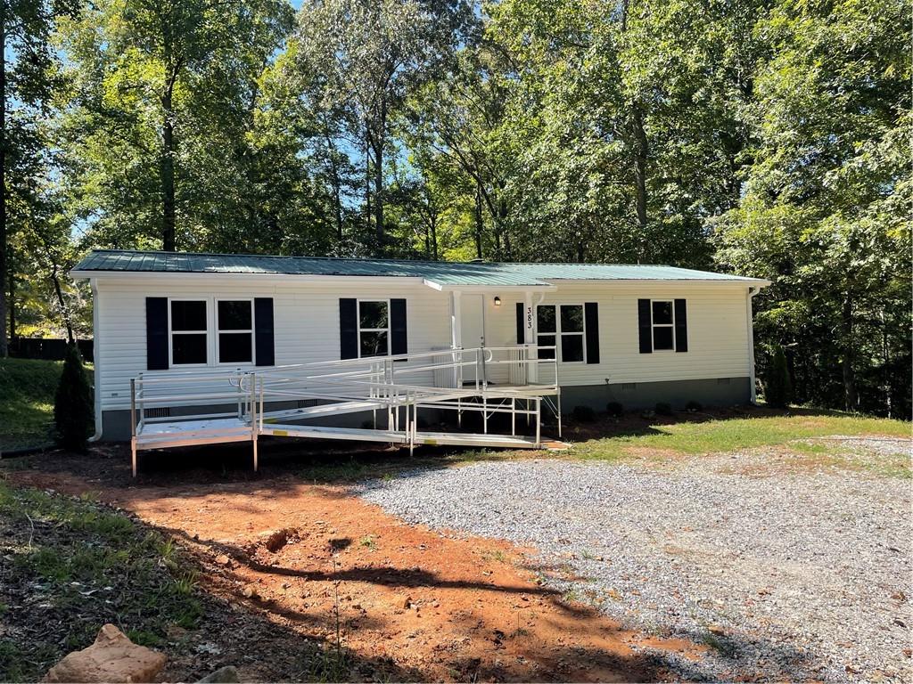 383 Bagwell Road Dawsonville, GA 30534 - Photo 2 of 24 a view of a house with a yard