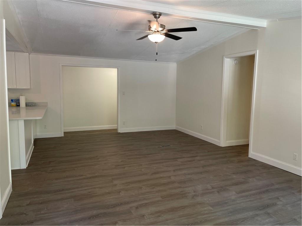 383 Bagwell Road Dawsonville, GA 30534 - Photo 3 of 24 a view of empty room with wooden floor and fan