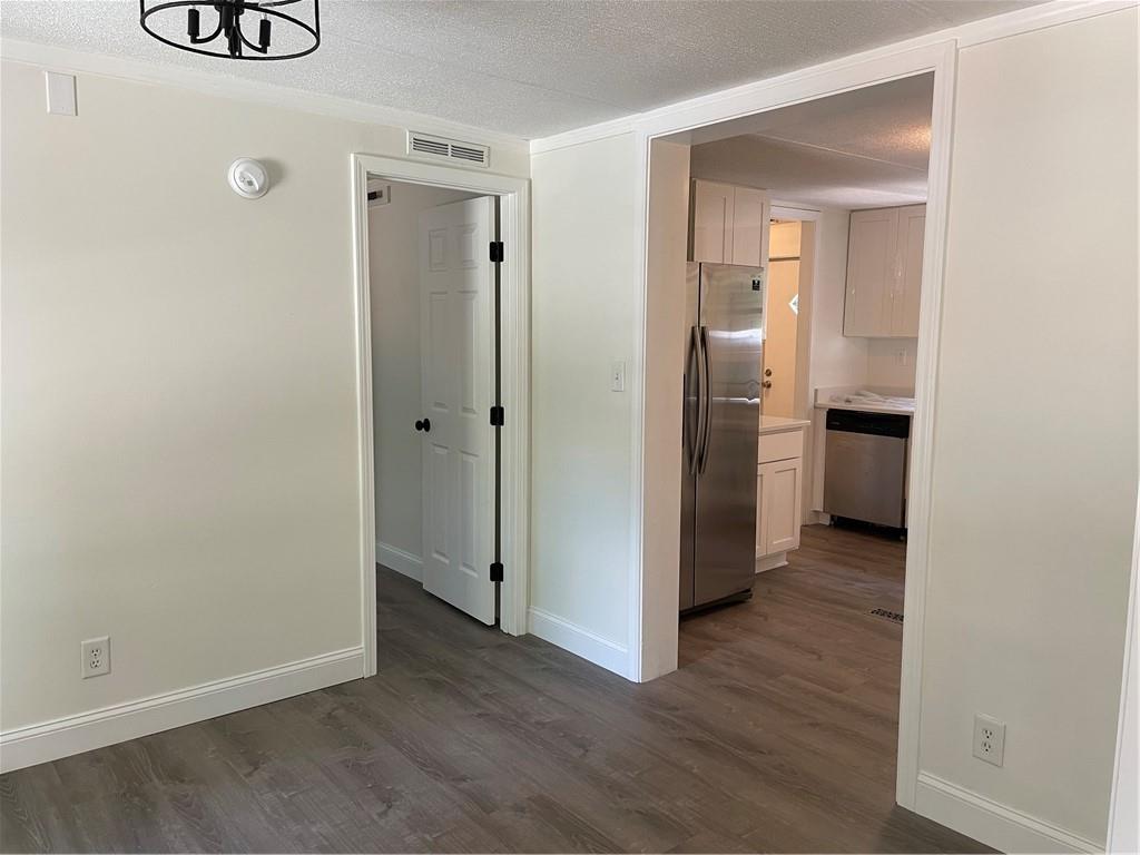 383 Bagwell Road Dawsonville, GA 30534 - Photo 6 of 24 a view of a kitchen with a refrigerator