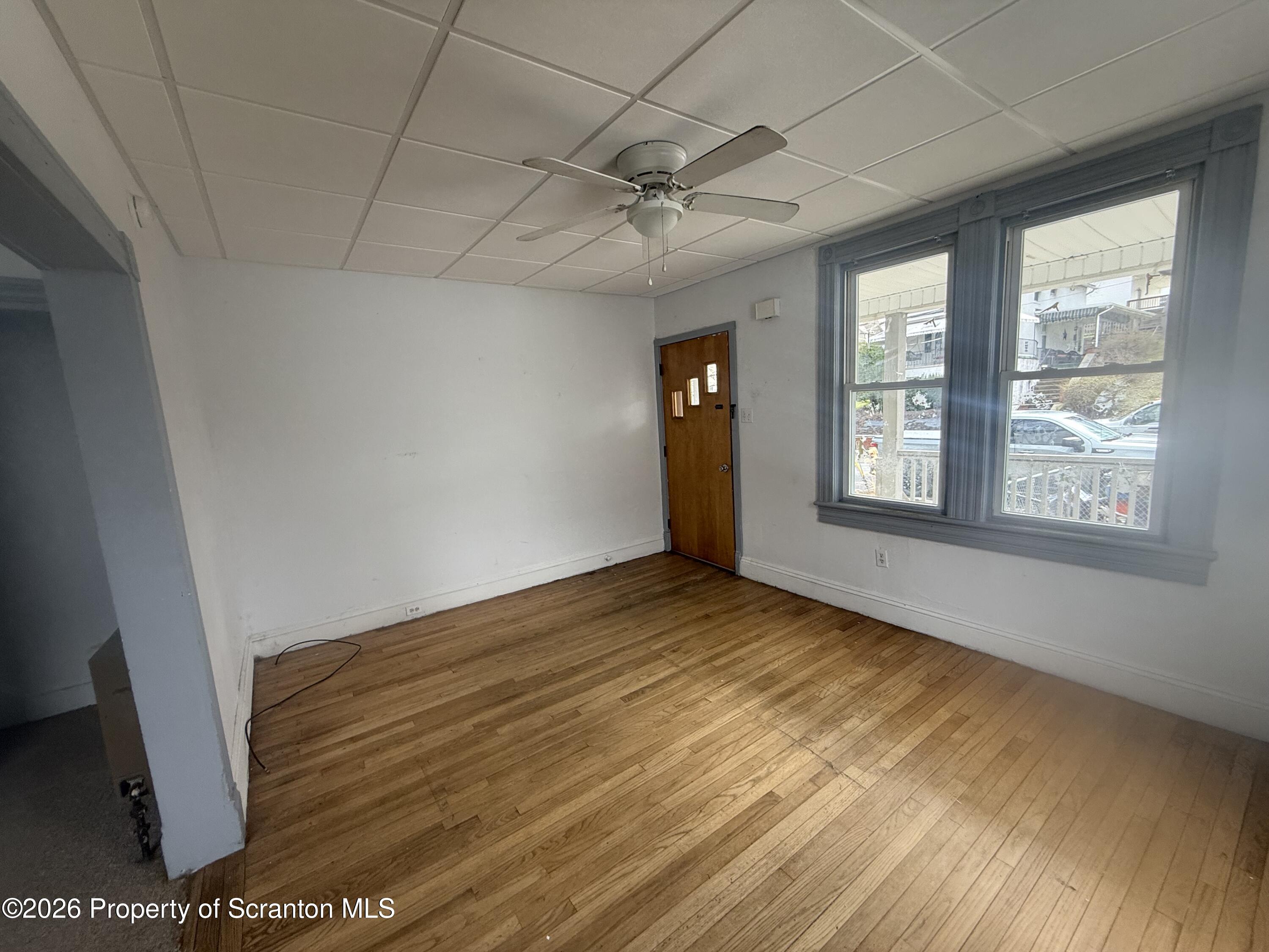 516 4th Street Dunmore, PA 18512 - Photo 2 of 8 a view of an empty room with a window