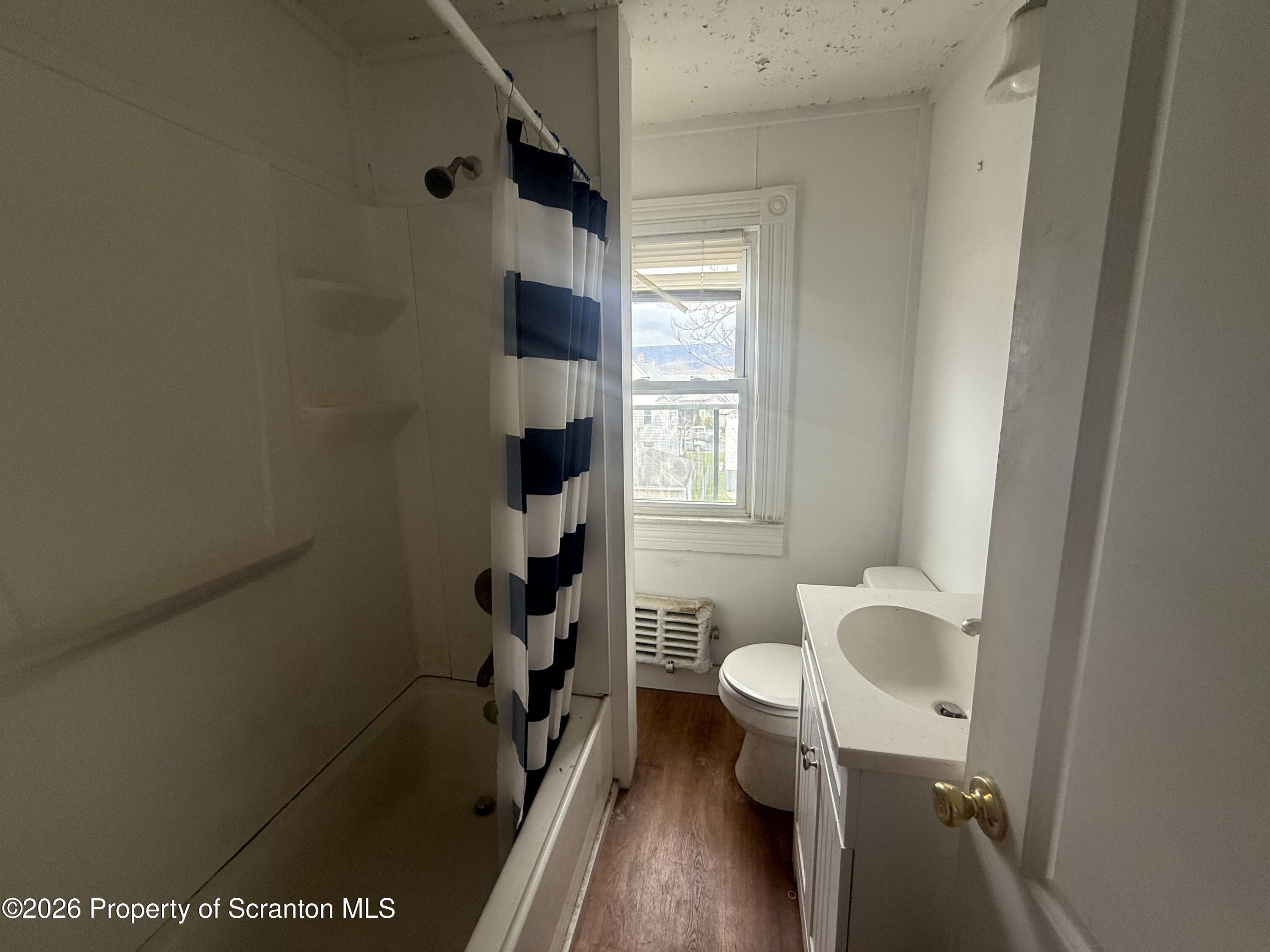 516 4th Street Dunmore, PA 18512 - Photo 8 of 8 a bathroom with a sink toilet and shower