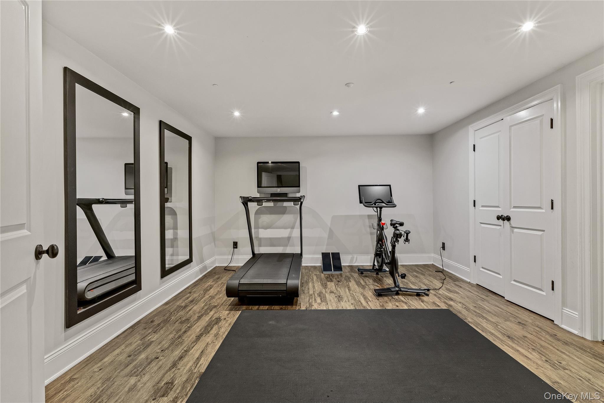 19 Park Drive South Rye, NY 10580 - Photo 39 of 42 This bright, professional home gym features performance flooring, expansive mirrors, and natural light. It’s an energizing, turnkey space designed for any fitness routine.