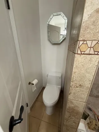 a bathroom with a sink vanity and mirror