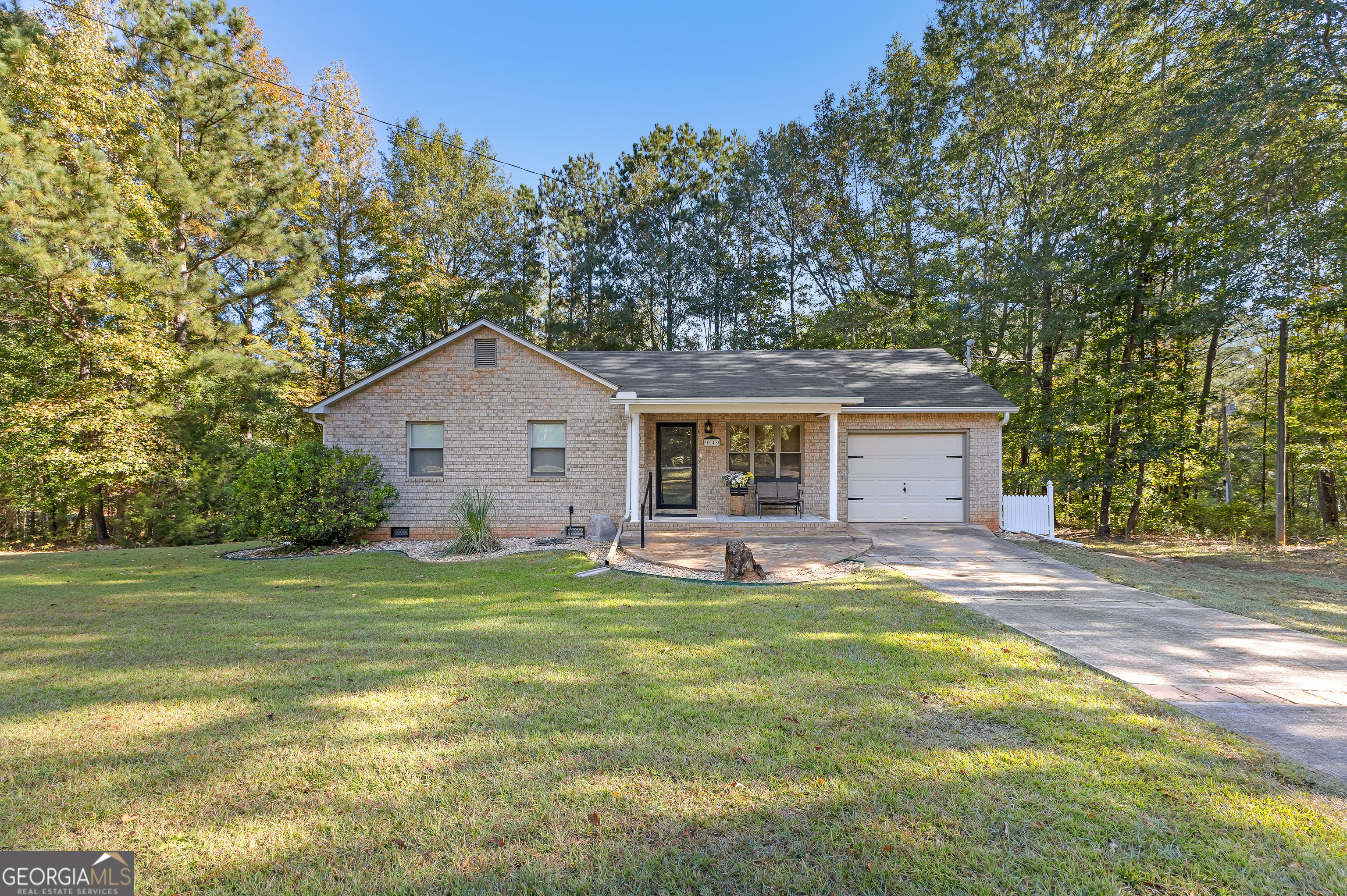1048 High Falls Road Jackson, GA 30233 - Photo 1 of 1 a house view with a garden space