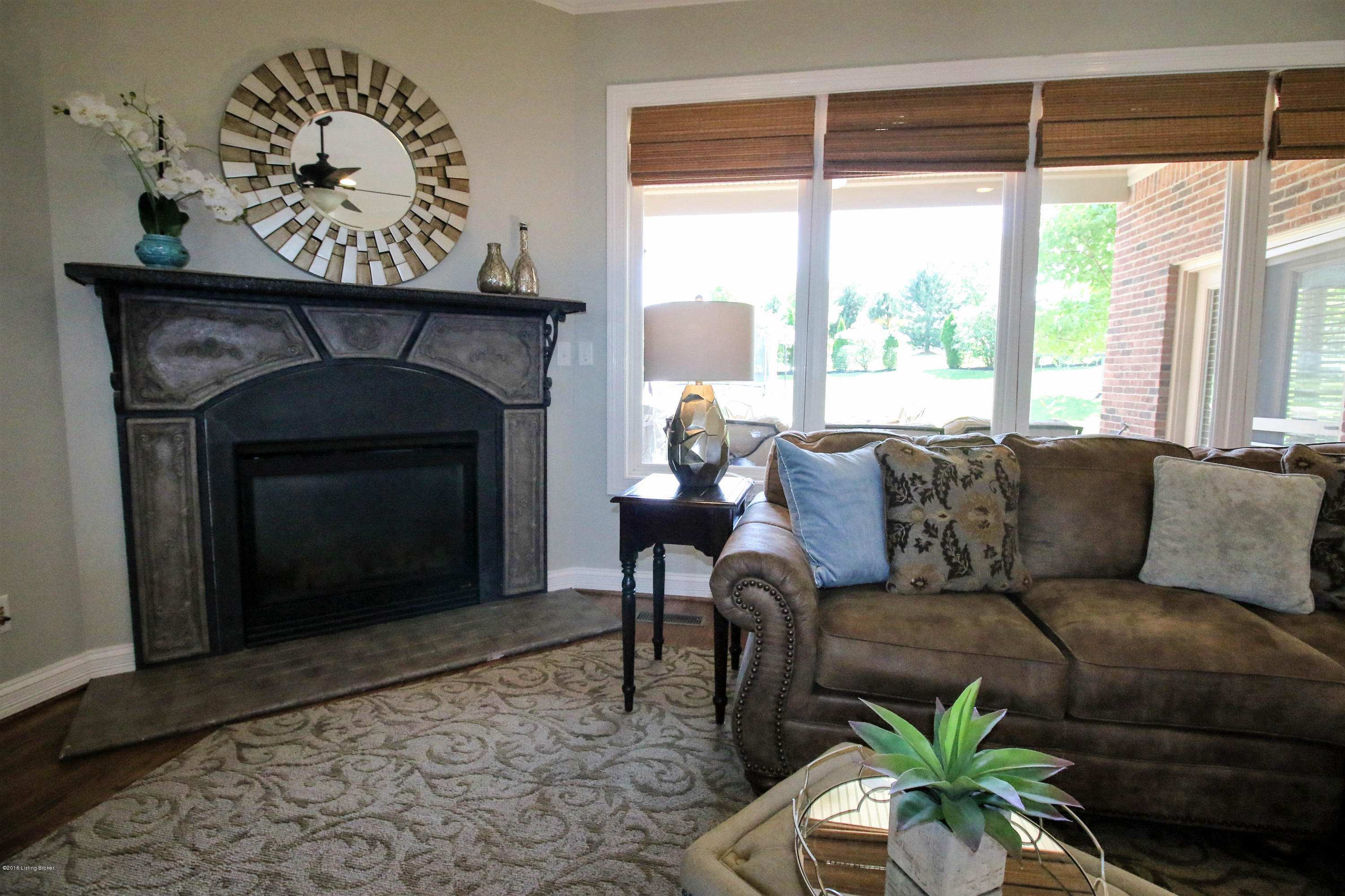 2904 Doe Ridge Court Prospect, KY 40059 - Photo 6 of 86 The fireplace is the focal point of the room and offers rustic finishes.