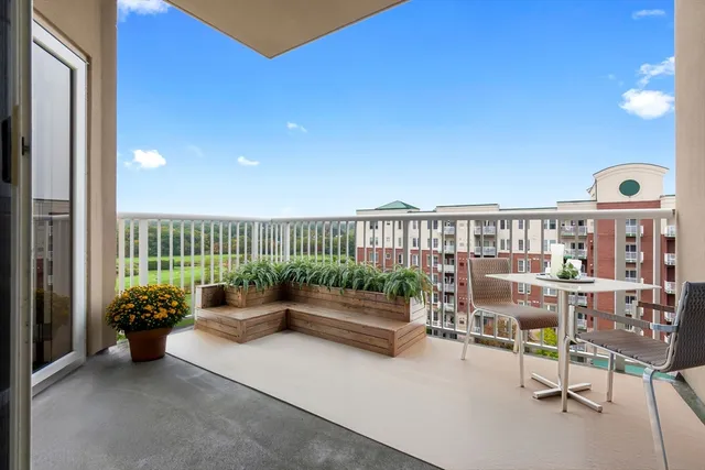 a view of a porch with furniture and a window