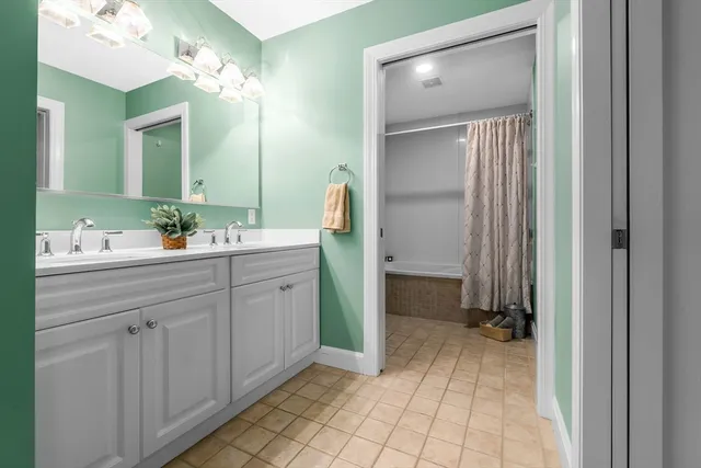 a white toilet sitting next to a shower