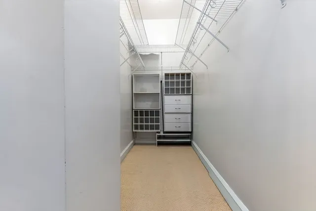 a bed room with a bed and a chair