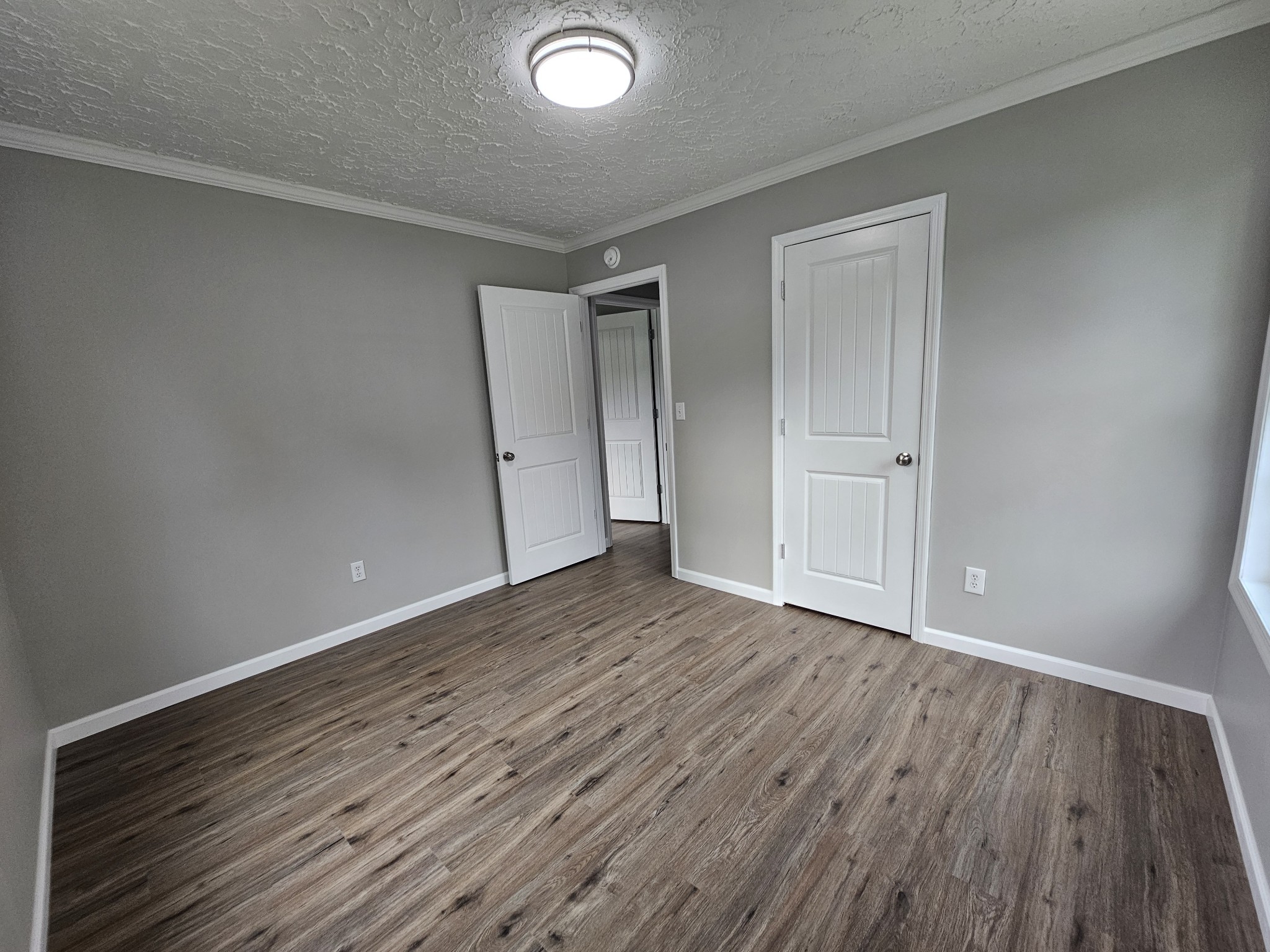 362 Forest Point Road Monteagle, TN 37356 - Photo 41 of 42 a view of an empty room and wooden floor
