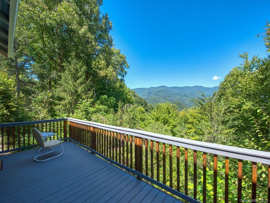a view of balcony with furniture