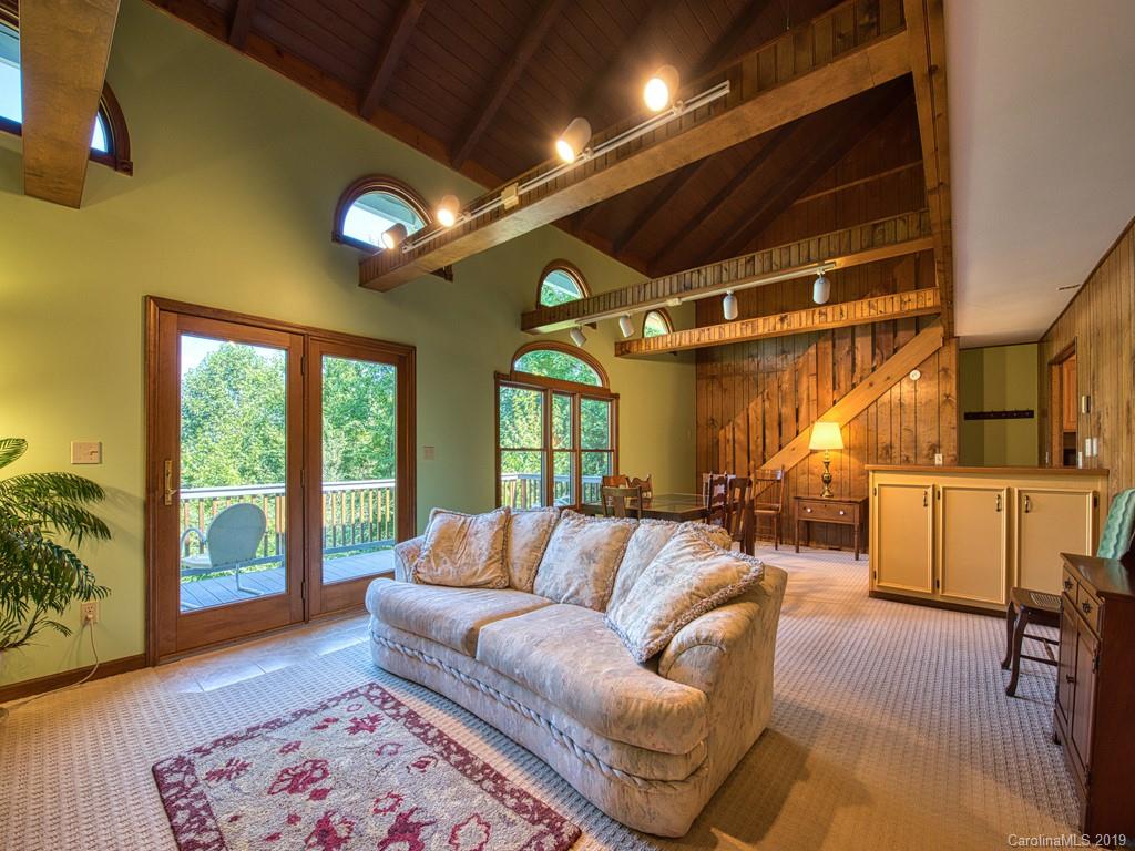 265 Shadow Ridge Sylva, NC 28779 - Photo 11 of 33 a living room with furniture and a large window