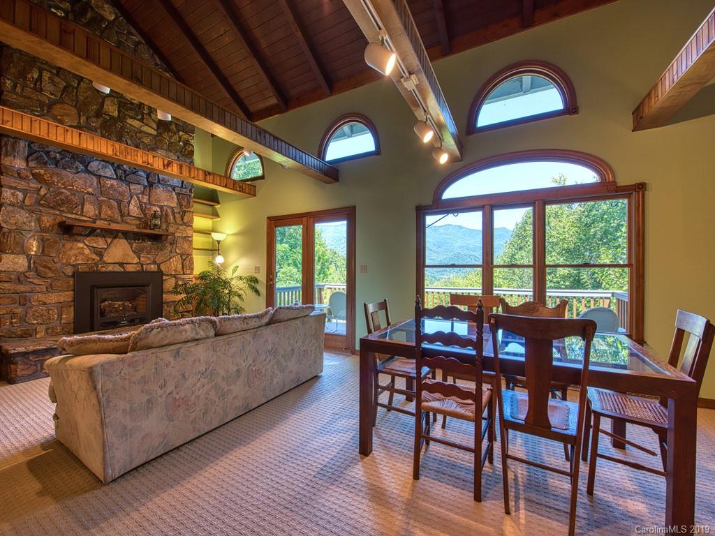 265 Shadow Ridge Sylva, NC 28779 - Photo 12 of 33 a view of a dining room with furniture window and wooden floor