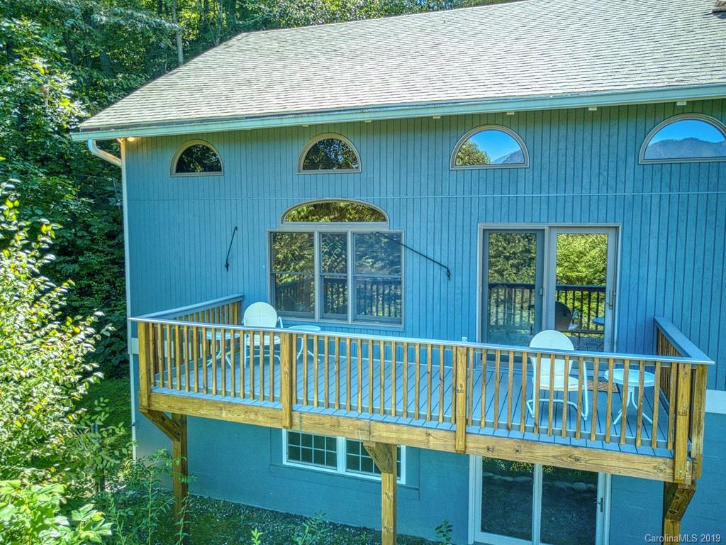 265 Shadow Ridge Sylva, NC 28779 - Photo 3 of 33 a view of a house with a yard and deck