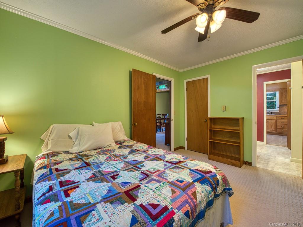 265 Shadow Ridge Sylva, NC 28779 - Photo 23 of 33 a bedroom with a bed and furniture