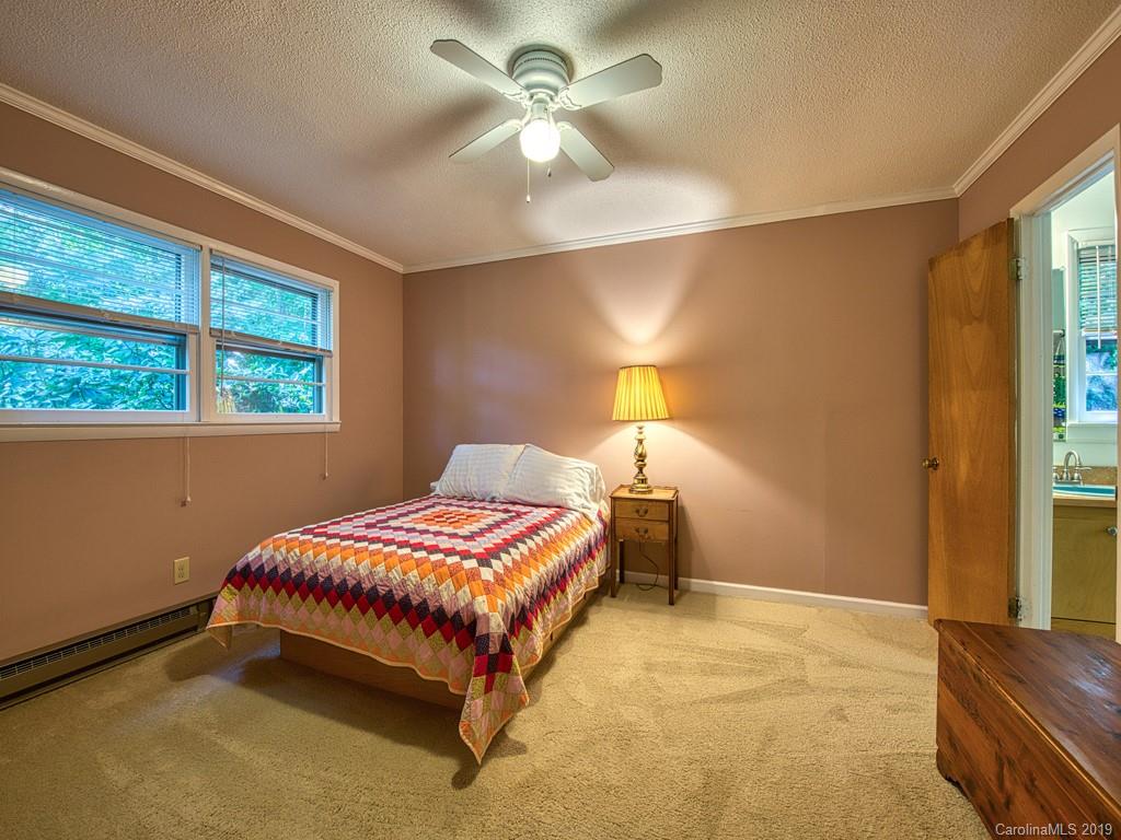 265 Shadow Ridge Sylva, NC 28779 - Photo 24 of 33 a bedroom with a bed and window