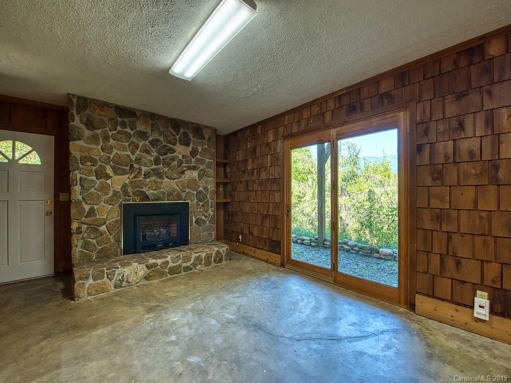 265 Shadow Ridge Sylva, NC 28779 - Photo 29 of 33 a view of empty room with fireplace and window