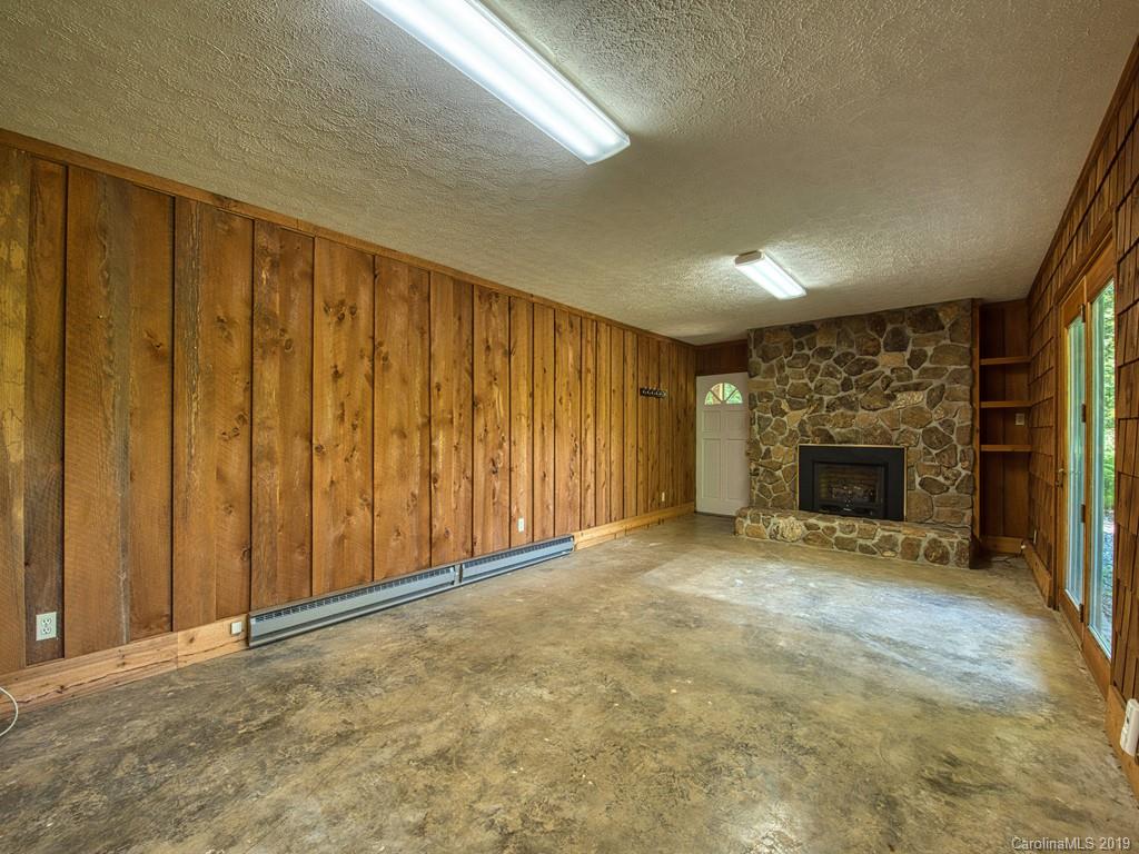 265 Shadow Ridge Sylva, NC 28779 - Photo 32 of 33 a view of an empty room with a fireplace