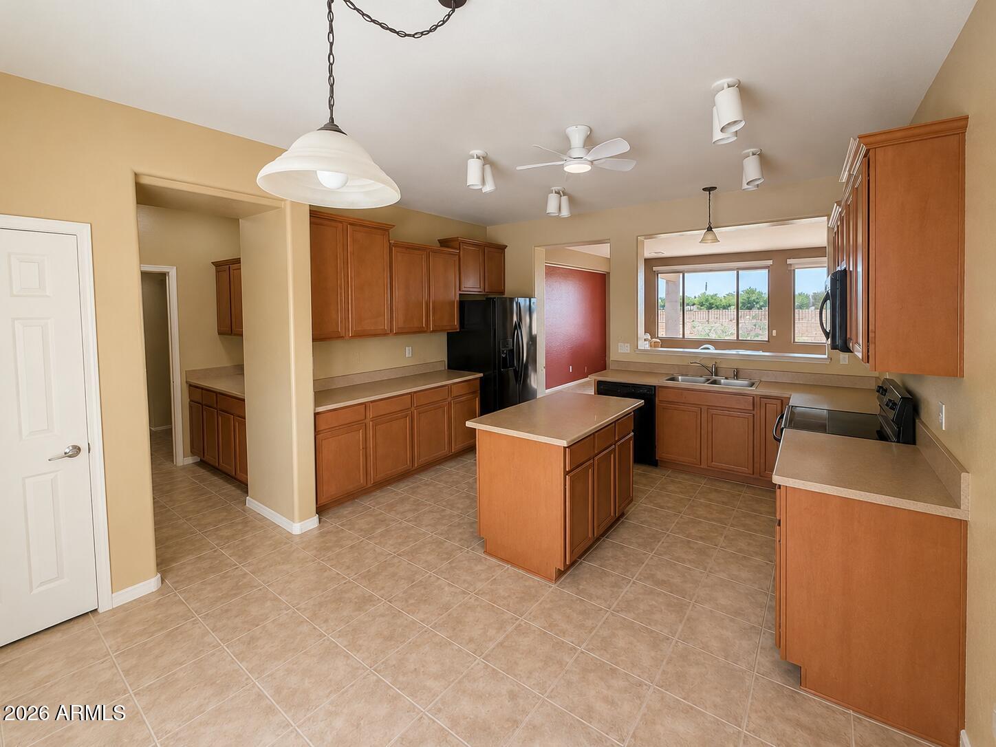 19466 East Reins Road Queen Creek, AZ 85142 - Photo 2 of 10 a view of a kitchen with microwave and cabinets