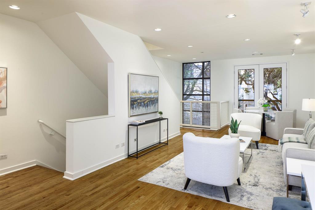 2910 Woodside Street Dallas, TX 75204 - Photo 11 of 24 a living room with furniture and wooden floor