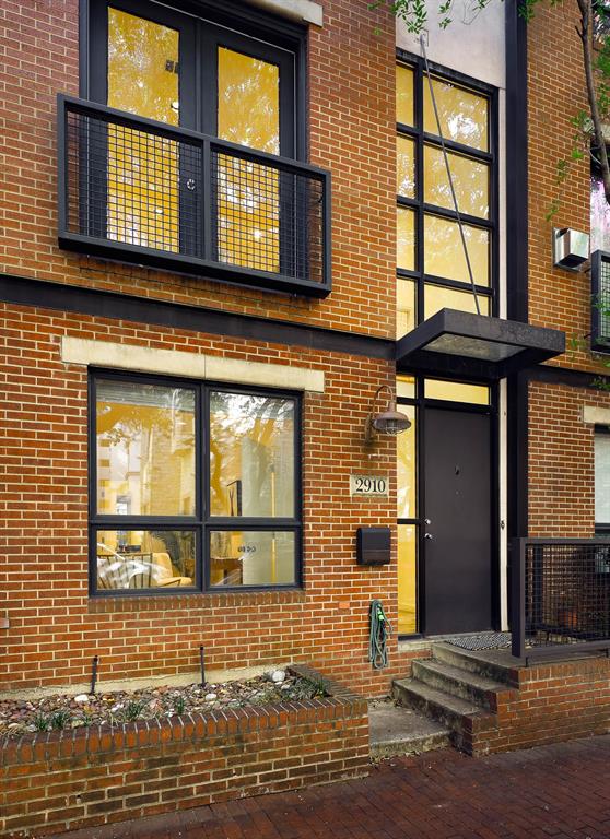 2910 Woodside Street Dallas, TX 75204 - Photo 24 of 24 a view of a brick house with large windows