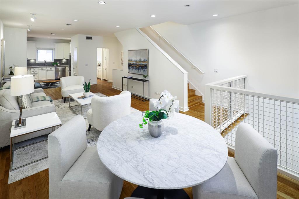 2910 Woodside Street Dallas, TX 75204 - Photo 4 of 24 a living room with couches white table and chairs