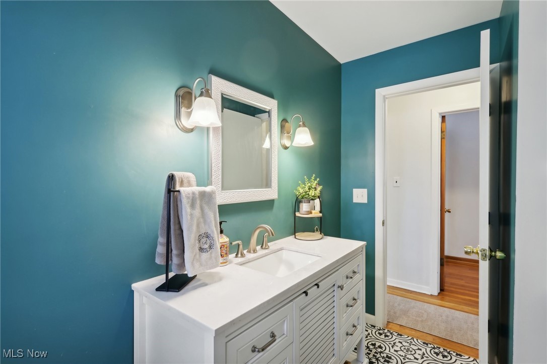 6086 Crossview Road Independence, OH 44131 - Photo 19 of 44 Bathroom with vanity and wood-type flooring