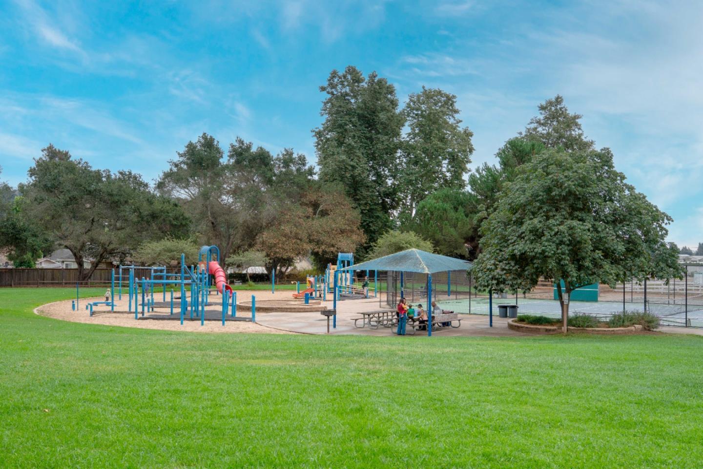 86 Blake Avenue Corralitos, CA 95076 - Photo 3 of 6 a view of a park with bench and trees