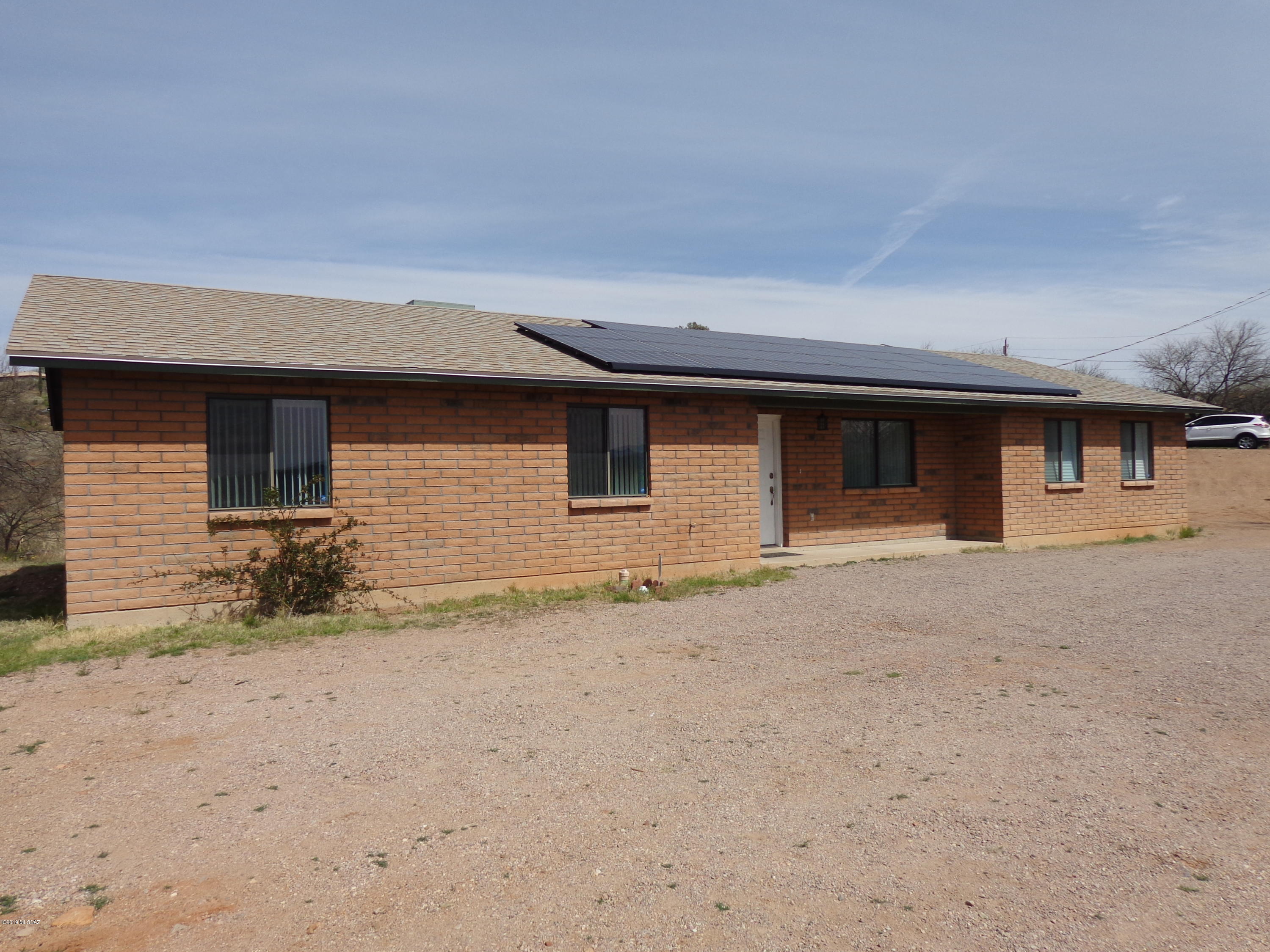 1223 Yave Court Rio Rico, AZ 85648 - Photo 1 of 15 front view of a house with a yard