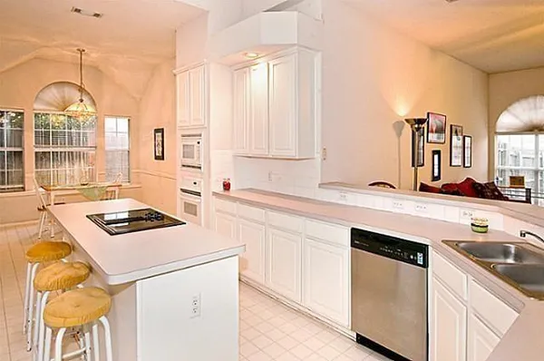 a kitchen with a stove and a sink