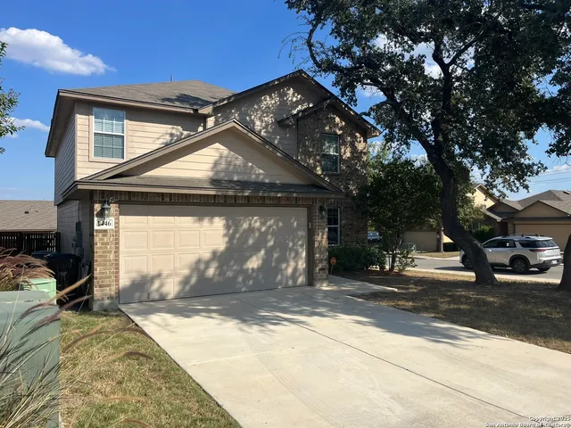 a view of a house with a snow in the yard