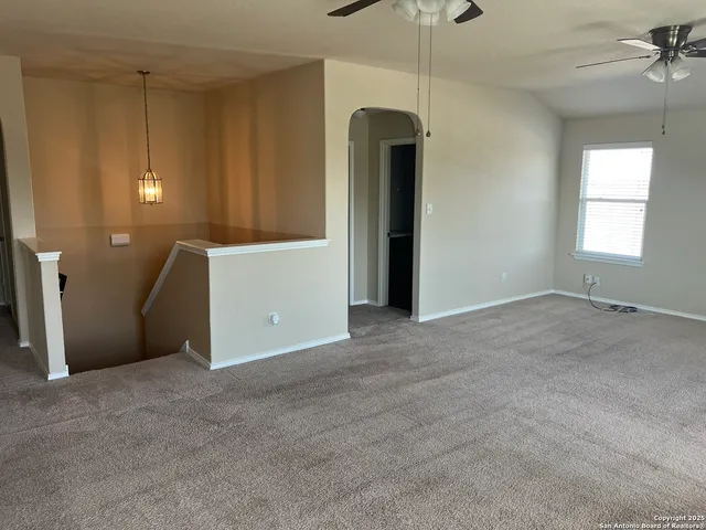 an empty room with windows and closet