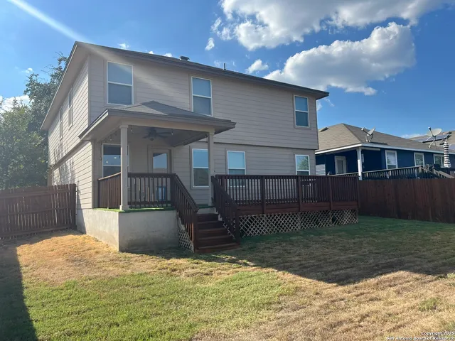 a view of a balcony with wooden floor