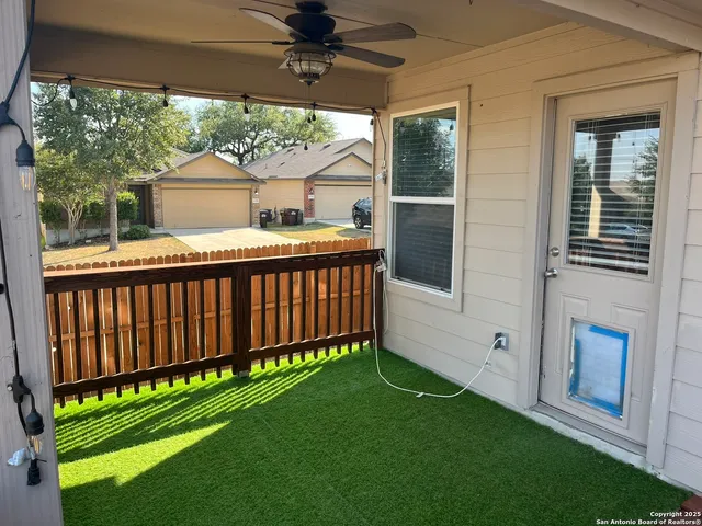 a view of a porch with wooden floor and outdoor space