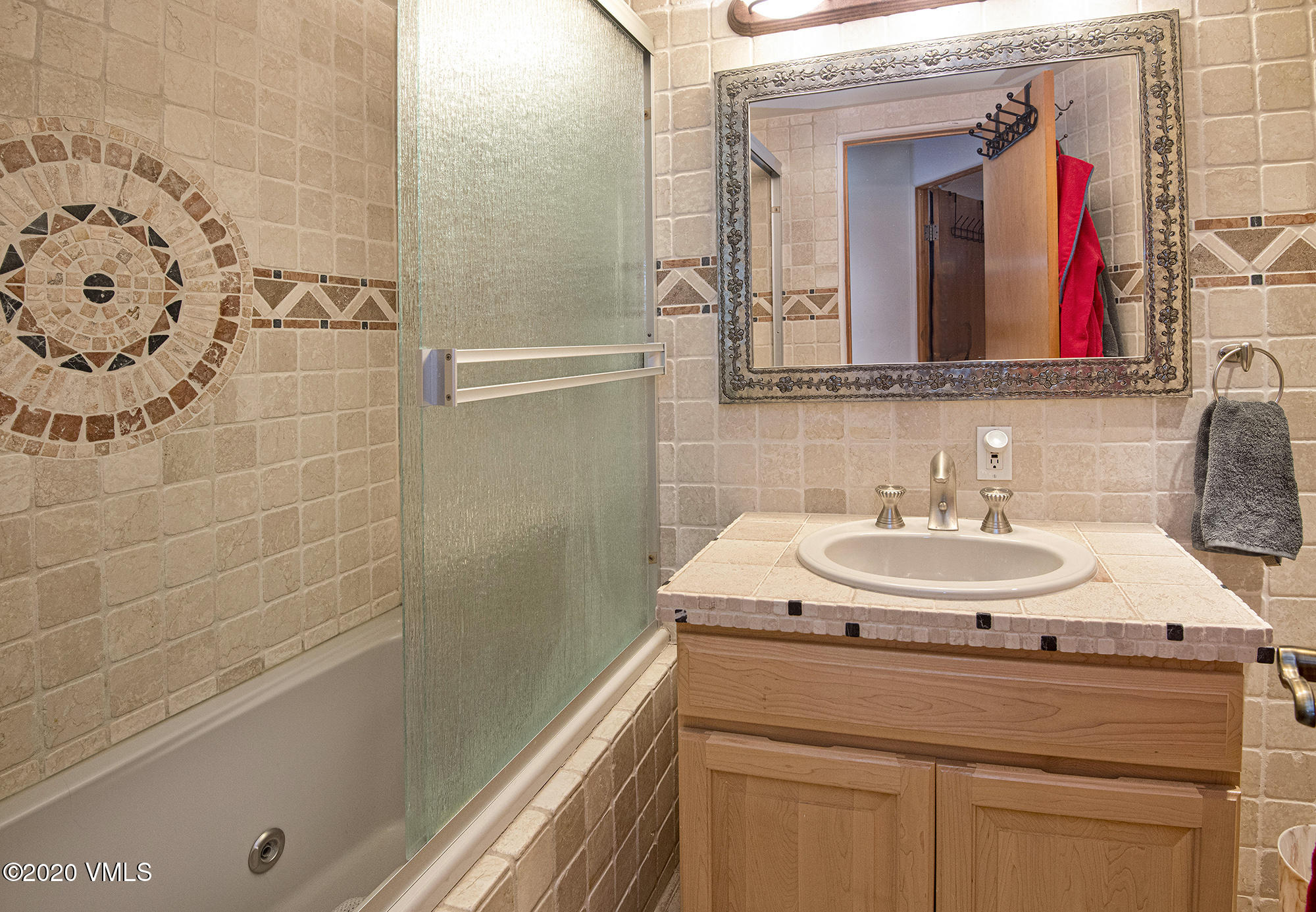 225 Wall Street, Unit 307 Vail, CO 81657 - Photo 11 of 31 a bathroom with a sink and a mirror