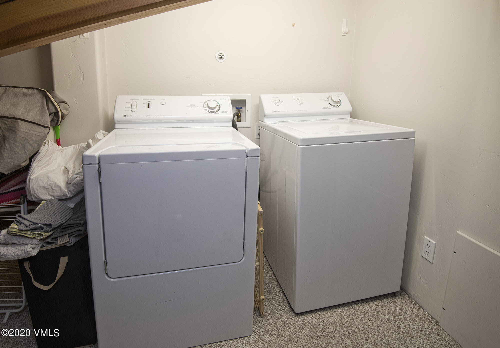 225 Wall Street, Unit 307 Vail, CO 81657 - Photo 16 of 31 a utility room with dryer and washer